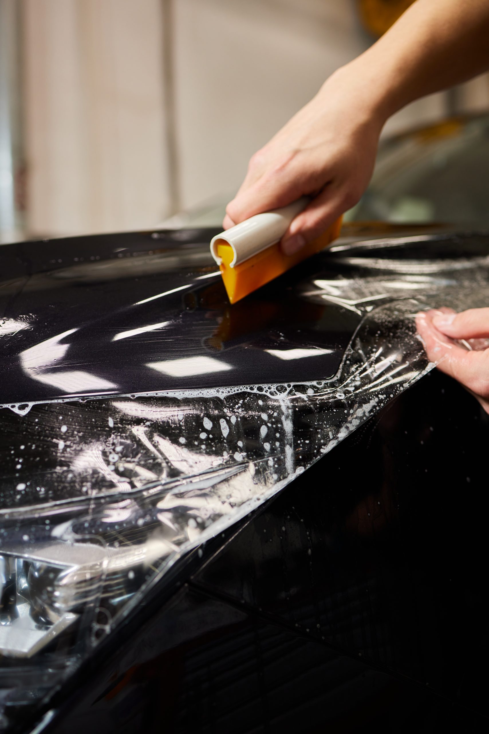 Protection of hood and front of the car with a colorless protective film.